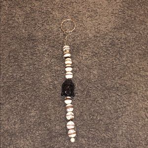 Super cute keychain with black Buddha in middle